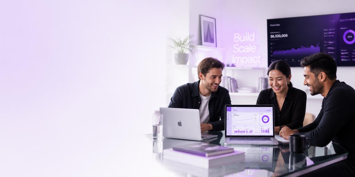 Founders reviewing growth dashboards in a bright studio office